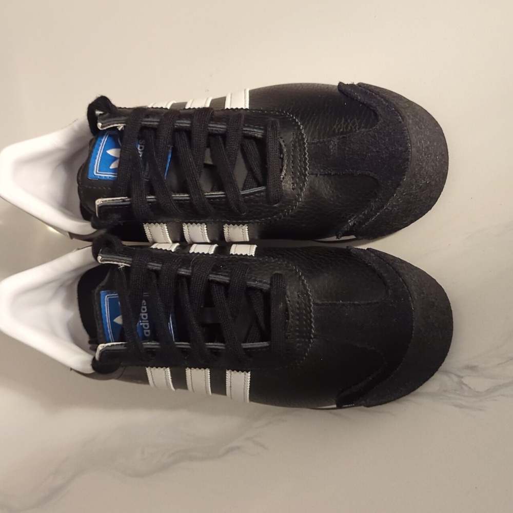 Black and white Samoa Adidas, big kid size 7